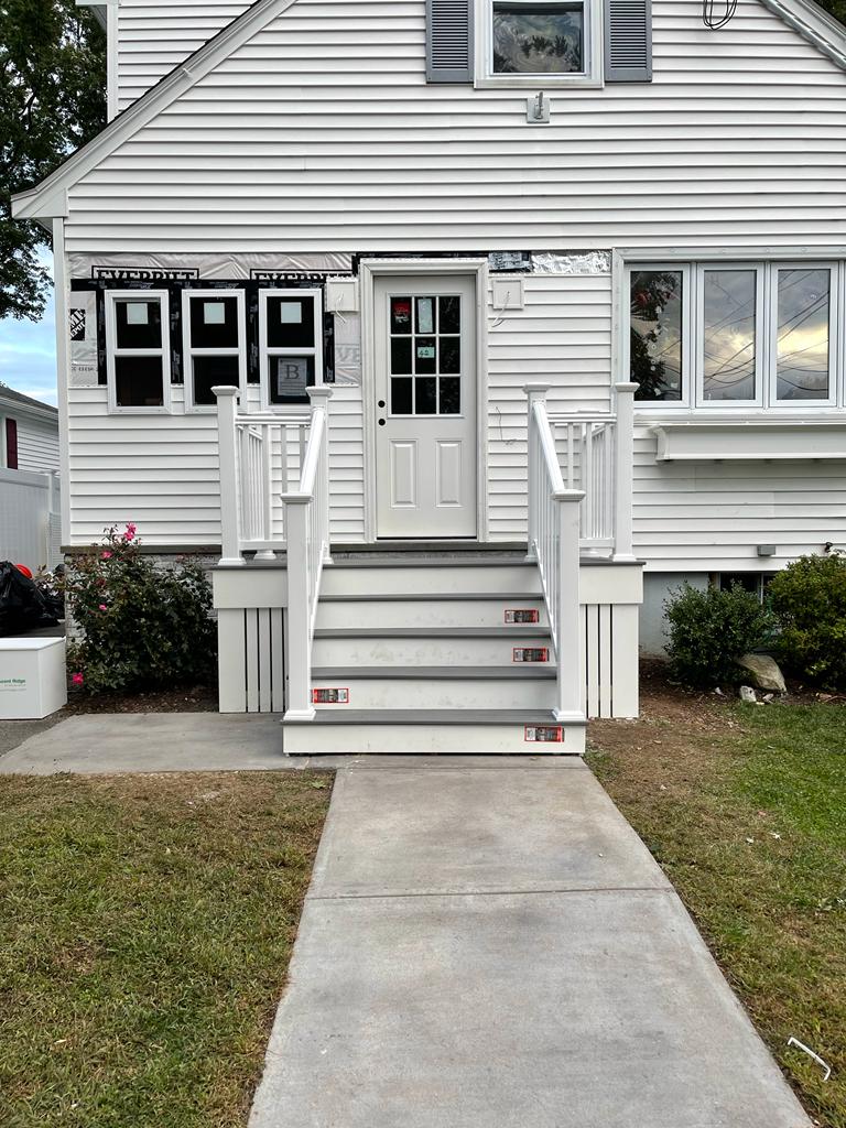 Curved exterior deck structure under renovation